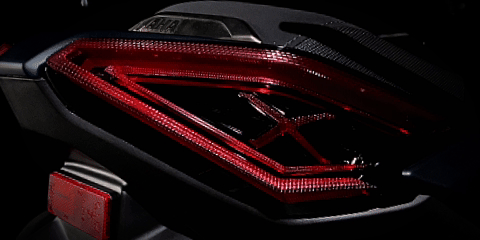 Close-up view of XMAX tail light with clear lens design