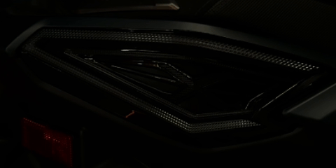 Close-up view of XMAX tail light with clear lens design